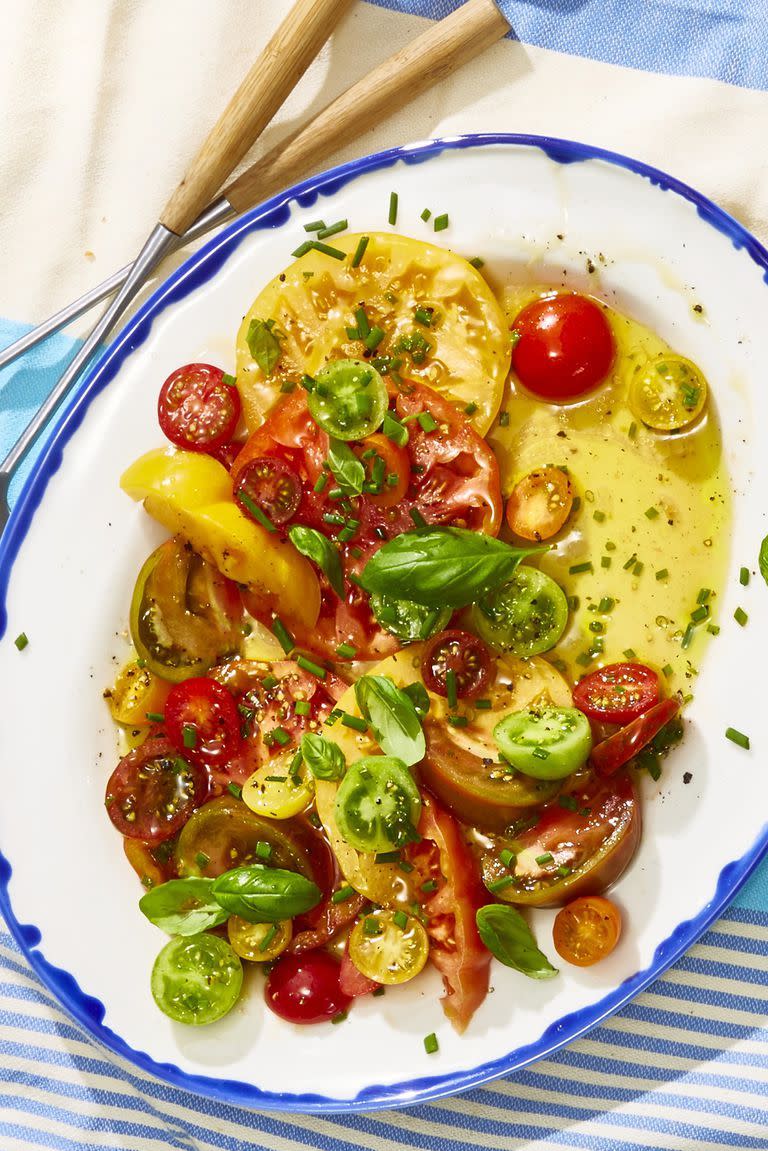 <p>This heirloom and grape tomato salad gives summer's finest the spotlight they deserve. </p><p>Get the <strong><a href="https://www.goodhousekeeping.com/food-recipes/a21752521/heirloom-tomato-salad-recipe/" rel="nofollow noopener" target="_blank" data-ylk="slk:Heirloom Tomato Salad recipe;elm:context_link;itc:0;sec:content-canvas" class="link ">Heirloom Tomato Salad recipe</a></strong>.</p><p><strong>RELATED: </strong><a href="https://www.goodhousekeeping.com/food-recipes/healthy/g2128/summer-salads/" rel="nofollow noopener" target="_blank" data-ylk="slk:40 Easy Summer Salads That Pack in the Best Seasonal Flavors;elm:context_link;itc:0;sec:content-canvas" class="link ">40 Easy Summer Salads That Pack in the Best Seasonal Flavors</a></p>