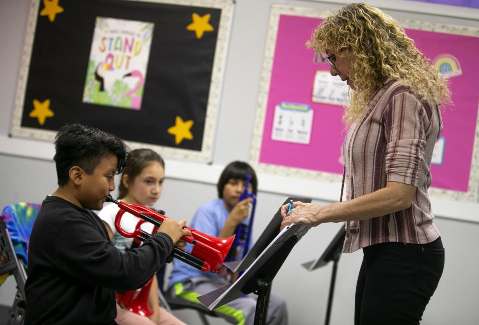 Band director Lynn Dillon instructs Gabe Valdibia, 8, how to play the trumpet. Children of Asbury Park are offered free music lessons through a program at the Salvation Army.    Asbury Park, NJThursday, November 17, 2022