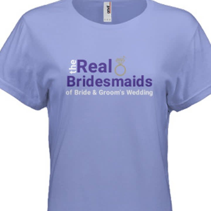 a purple shirt with text reading 