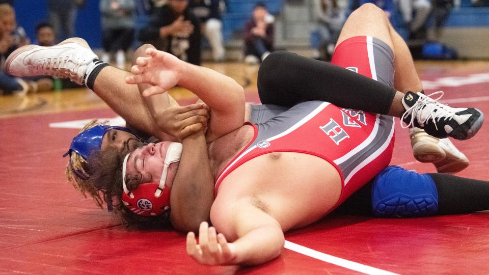 Paul VI's Anthony Jackson controls Haddon Township's Chris Broderick during the 215 lb. bout of the championship round of the District 28 wrestling tournament held at the Rowan College of South Jersey in Deptford on Saturday, February 17, 2024. Jackson defeated Broderick by pin.