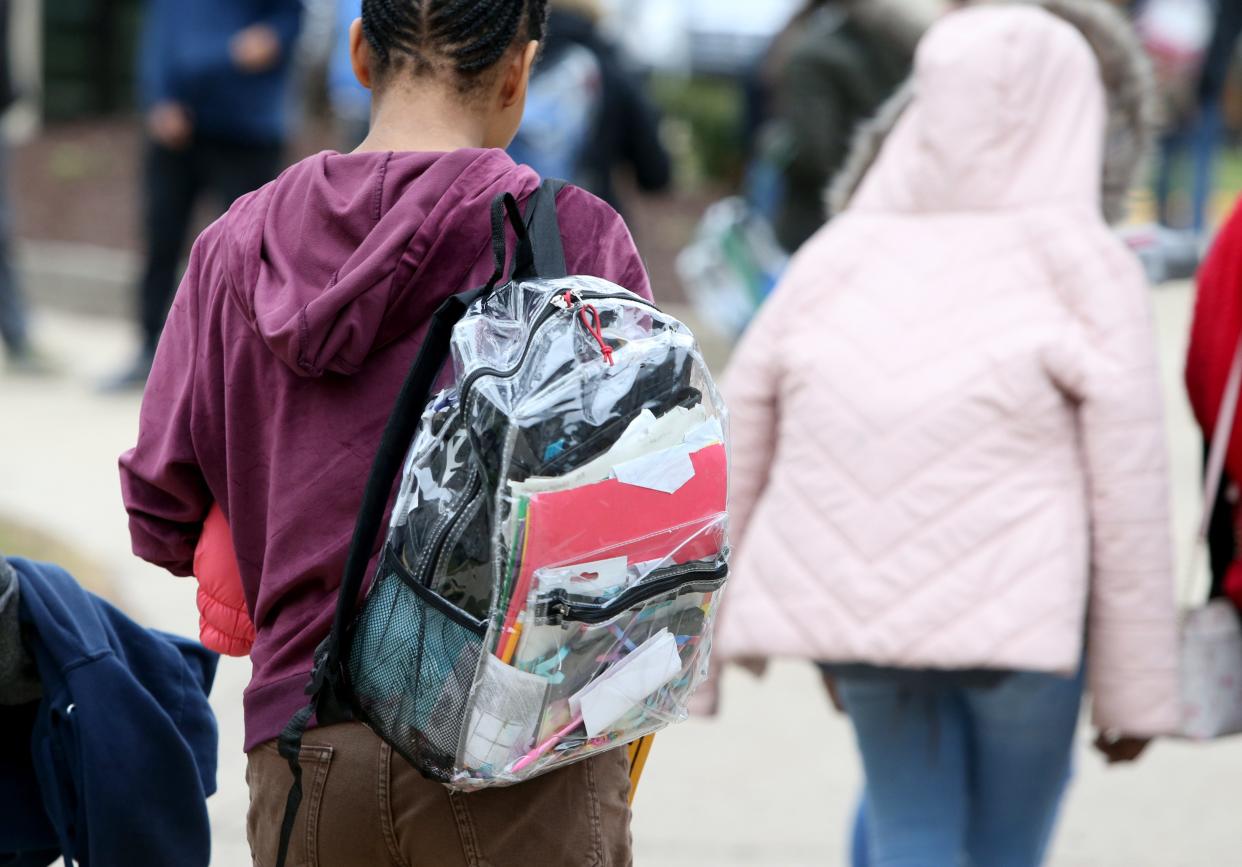 Students use clear backpacks for security concerns Thursday, Dec. 15, 2022, at Navarre Middle School in South Bend. Navarre is in the South Bend school district's empowerment zone.