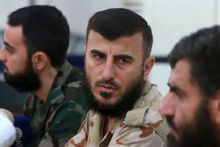 Zahran Alloush (C), commander of Jaysh al Islam, talks during a conference in the town of Douma, eastern Ghouta in Damascus, Syria August 27, 2014. REUTERS/Bassam Khabieh/Files