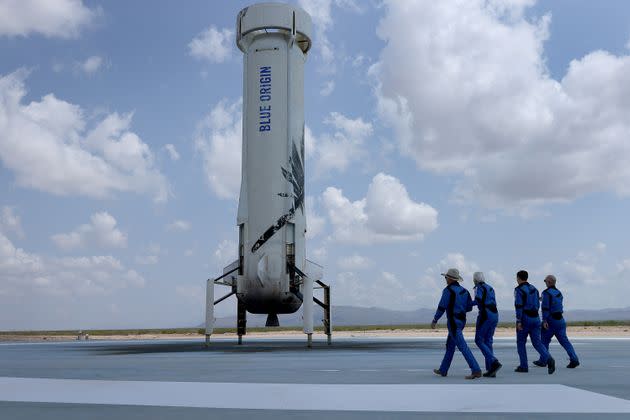 VAN HORN, TEXAS - JULY 20: Blue Origin’s New Shepard crew (L-R) Jeff Bezos, Wally Funk, Oliver Daemen, and Mark Bezos walk near the booster to pose for a picture after flying into space in the Blue Origin New Shepard rocket on July 20, 2021 in Van Horn, Texas. Mr. Bezos and the crew were the first human spaceflight for the company. (Photo by Joe Raedle/Getty Images) (Photo: Joe Raedle via Getty Images)