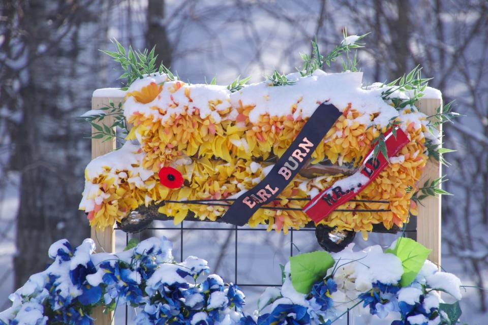 A memorial for Earl Burns Sr., 66, in James Smith Cree Nation at the place he died on Sept. 4 inside a school bus he used to distract suspect Myles Sanderson and save his family.