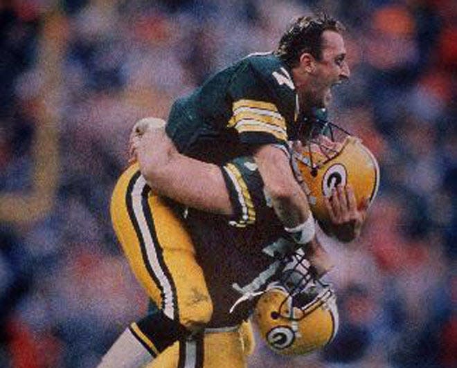 Green Bay nose tackle Bob Nelson lifts quarterback Don Majkowski after instant replayed showed the Packers quarterback did not step over the line of scrimmage when he threw a touchdown in the final minute of a 14-13 victory over the Chicago Bears at Lambeau Field on Nov. 5, 1989.