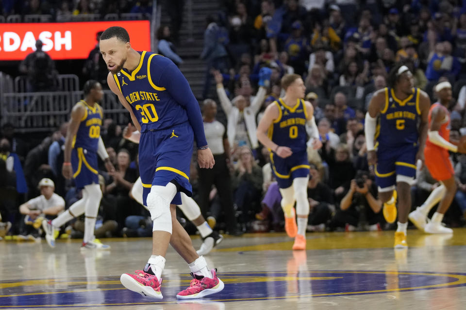 Golden State Warriors guard Stephen Curry (30) reacts after making a 3-point basket against the Oklahoma City Thunder during the first half of an NBA basketball game in San Francisco, Tuesday, April 4, 2023. (AP Photo/Jeff Chiu)