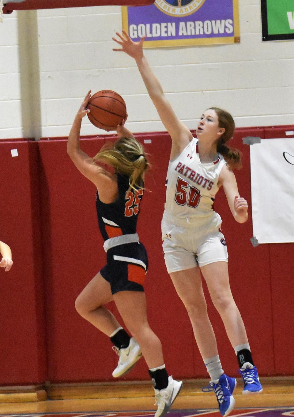 Reagan Martin goes for the block against North Putnam. Martin has broken the blocks in a game, blocks in a season and blocks in a career records already this year.