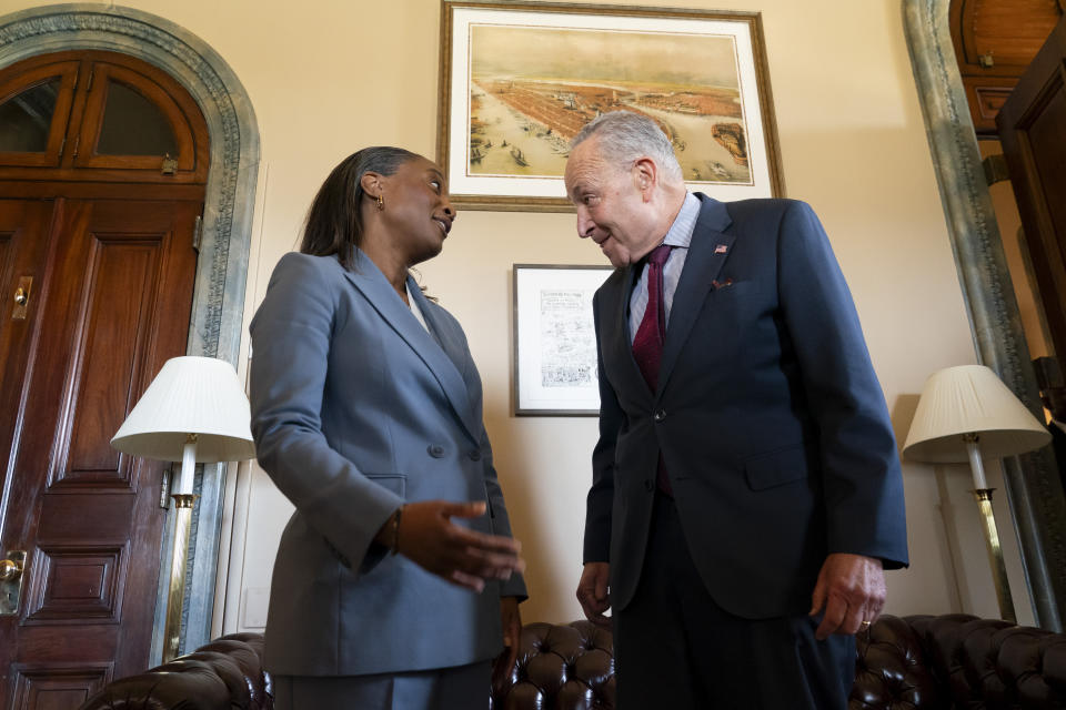 Senate Majority Leader Chuck Schumer, D-N.Y., meets with Laphonza Butler before she is sworn in to succeed the late Sen. Dianne Feinstein, D-Calif., Tuesday, Oct. 3, 2023, on Capitol Hill in Washington. (AP Photo/Stephanie Scarbrough)