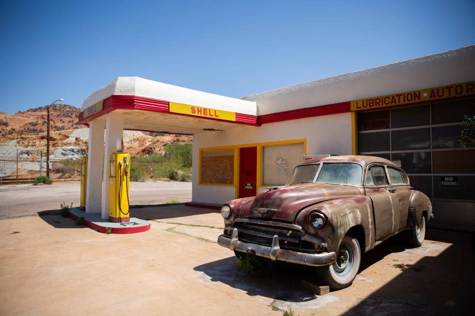 An old Chevrolet vehicle sits outside an old Shell gas station and auto repair shop in Bisbee on June 24, 2023.