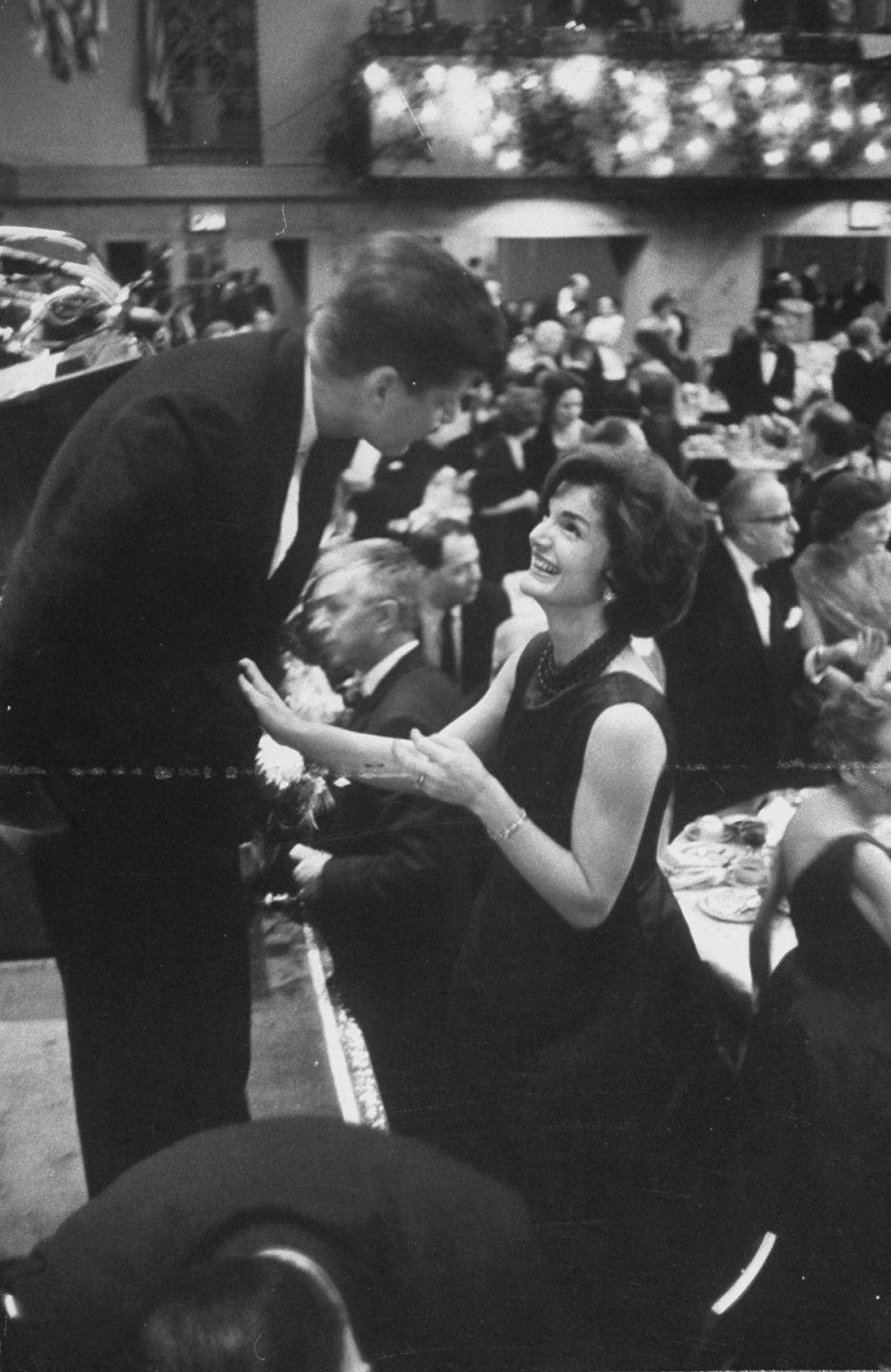 1959: John F. Kennedy and Jacqueline Kennedy attend a holiday party