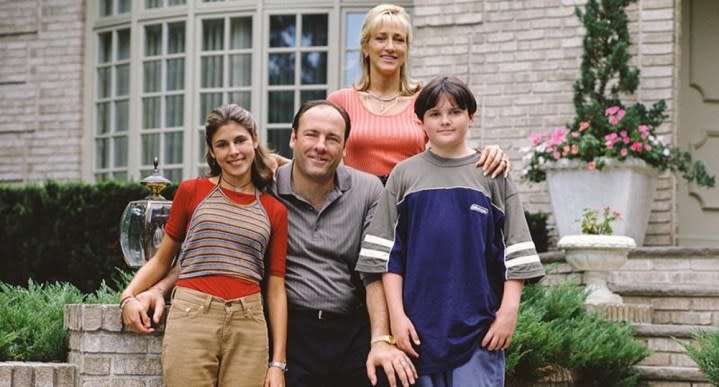 A family of four poses in The Sopranos.