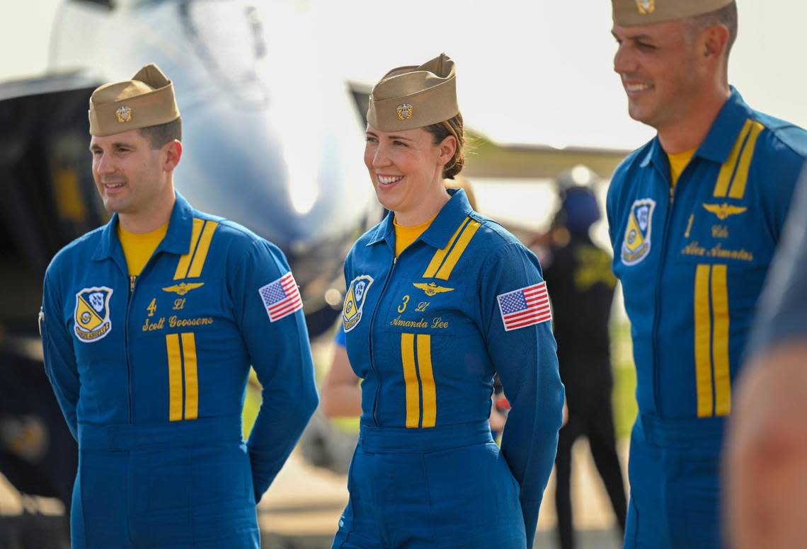 U.S. Navy Blue Angels pilots, from left, Lt. Scott Goossens, Lt. Amanda Lee, the Navy’s first female Blue Angels pilot, and Cmdr. Alexander Armatas, stood for a meet and greet after arriving on Thursday, Aug. 17, 2023, at the New Century AirCenter in Gardner, Kansas, for the Garmin KC Air Show. Lee is a F/A-18E/F demo pilot and flies in the left wing slot.