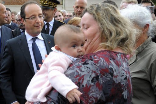 French President Francois Hollande (left) speaks with with a woman holding her baby in Dieudonne, north of Paris, this week. Fresh from his victory last month over right-winger Nicolas Sarkozy, Hollande is set to consolidate his hold on power as he seeks to navigate France through Europe's financial crisis, rising joblessness and a stagnant economy