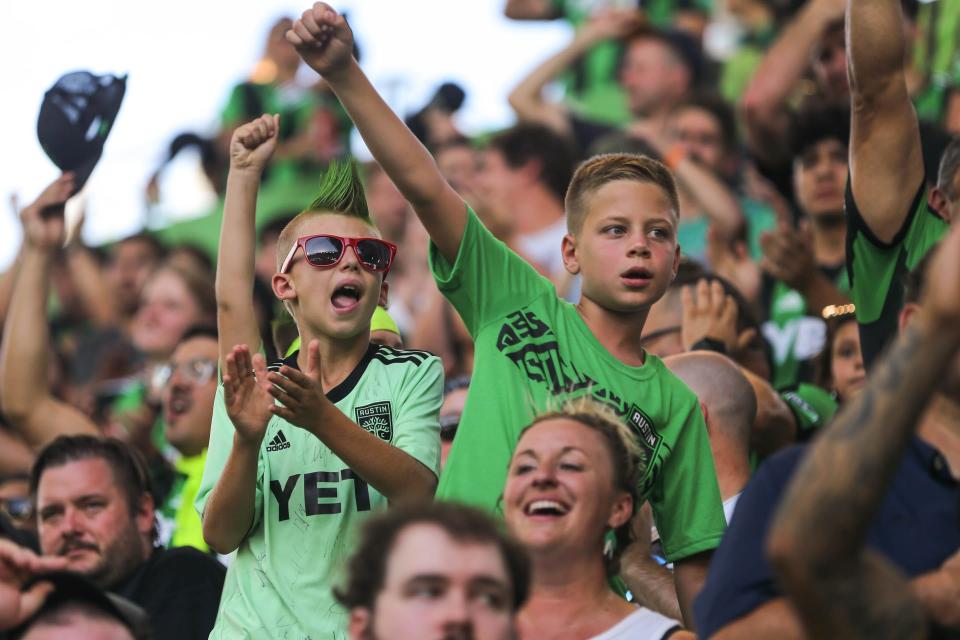 Young Austin FC fans cheer on the team from the Los Verdes fan section during the match against the New York Red Bulls at Q2 Stadium on Sunday. COVID-19 cases have not dropped significantly in Austin this summer, but we haven't had an uncontrolled surge like in the two summers before.