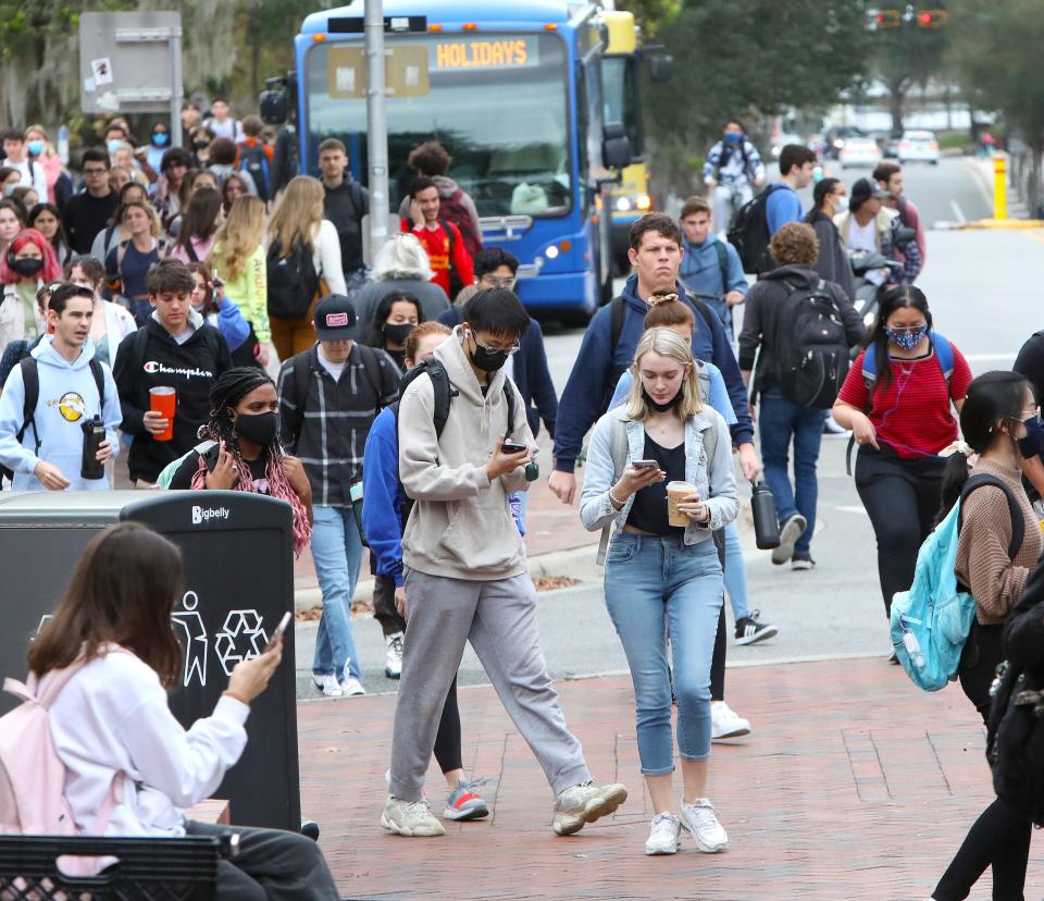 Students walk near The Hub off Stadium Road on the University of Florida campus as the spring 2022 semester begins at the university, in Gainesville on Jan. 5, 2022.