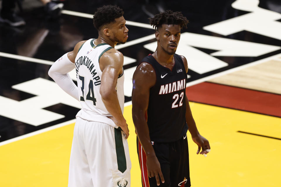 Giannis Antetokounmpo's Bucks and Jimmy Butler's Heat have each ousted each other in the past two NBA playoffs. (Michael Reaves/Getty Images)