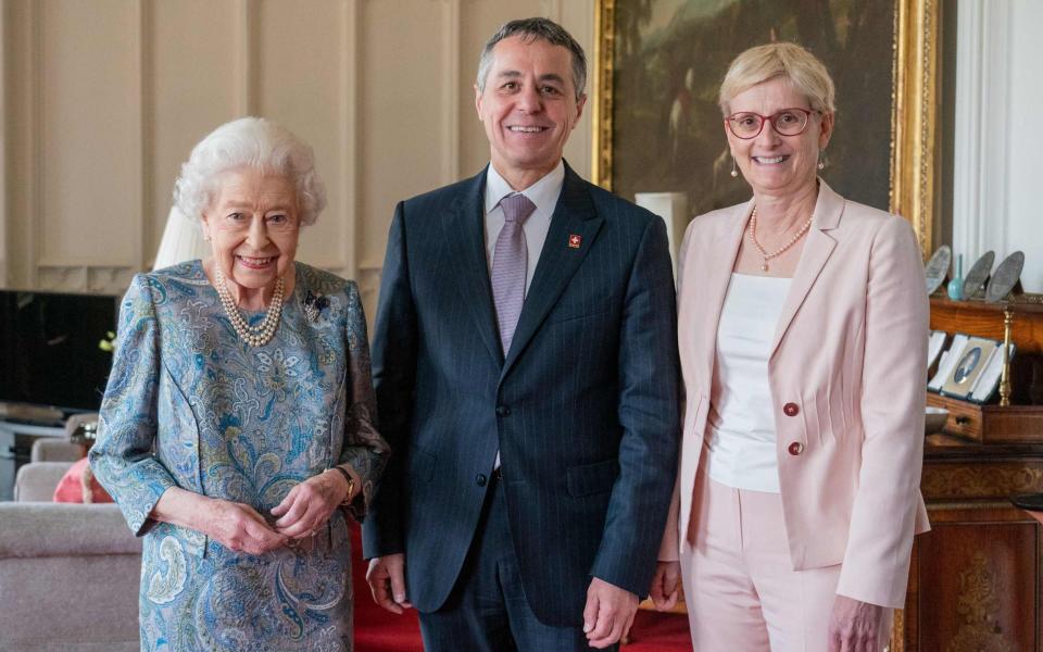 Her Majesty beams as she stands next to Ignazio Cassis, the president of Switzerland, and his wife Paola - Dominic Lipinski/AFP via Getty Images 