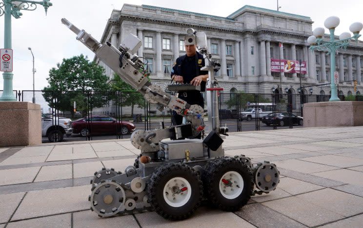 Police bomb squad technician Sgt. Tim Maffo-Judd demonstrates a Remotec F5A explosive ordnance device robot near the site of the Republican National Convention in Cleveland on Thursday. (Photo: Rick Wilking/Reuters)