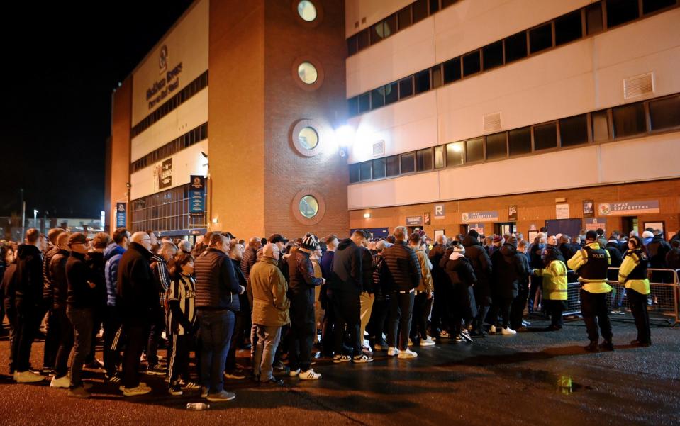 Newcastle fans queue to get into the Darwen End
