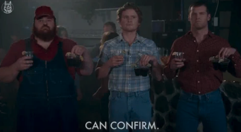 Three men, dressed in casual farm attire, each holding multiple jugs of beer, stand in a dimly lit room. Text reads "CAN CONFIRM."