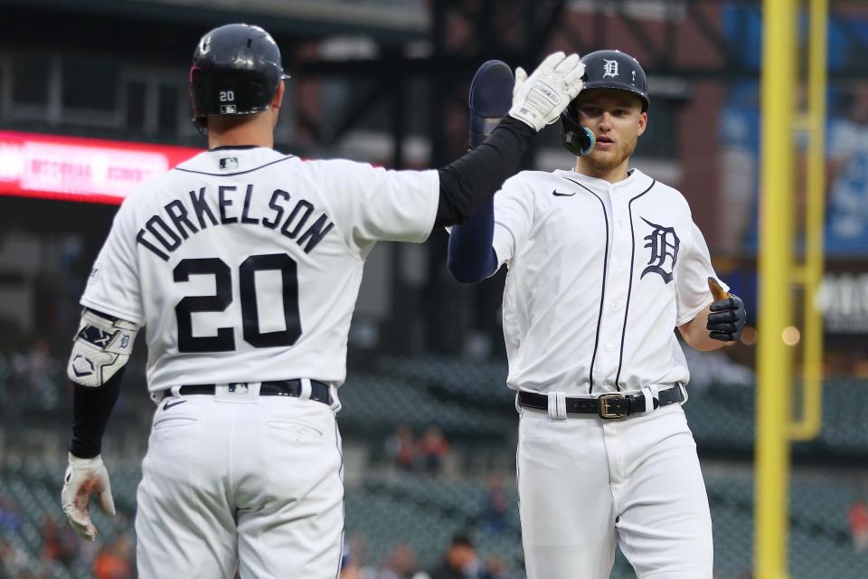 Parker Meadows of the Detroit Tigers celebrates scoring a run in the seventh inning with Spencer Torkelson while playing the Kansas City Royals at Comerica Park on September 28, 2023 in Detroit, Michigan.