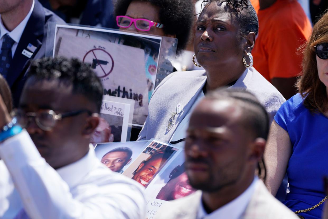 Guests listen as President Joe Biden speaks during an event to celebrate the passage of the "Bipartisan Safer Communities Act," a law meant to reduce gun violence, on the South Lawn of the White House, Monday, July 11, 2022, in Washington. 