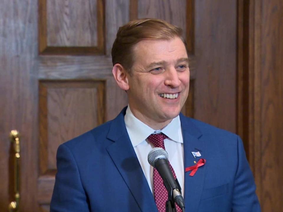 Premier Andrew Furey smiled as he spoke with reporters Wednesday, the last day of the spring sitting of the House of Assembly.   (Curtis Hicks/CBC  - image credit)