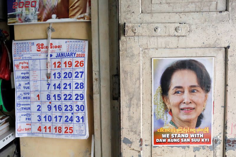 FILE PHOTO: A poster supporting Myanmar State Counselor Aung San Suu Kyi is seen in a shop in Yangon