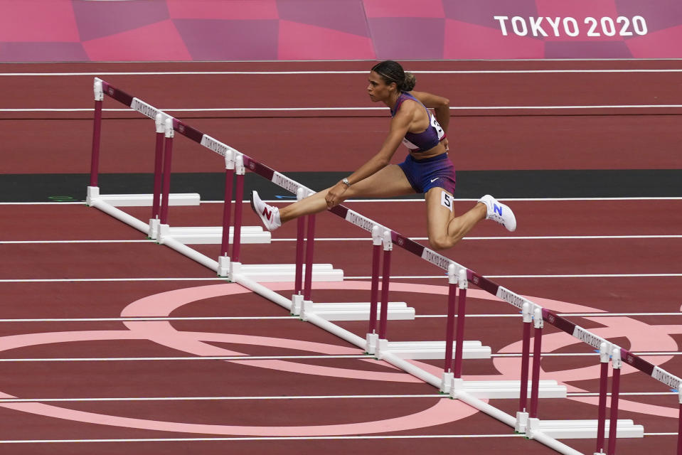 Sydney Mclaughlin, of United States, wins a heat in the women's 400-meter hurdles at the 2020 Summer Olympics, Saturday, July 31, 2021, in Tokyo. (AP Photo/Martin Meissner)
