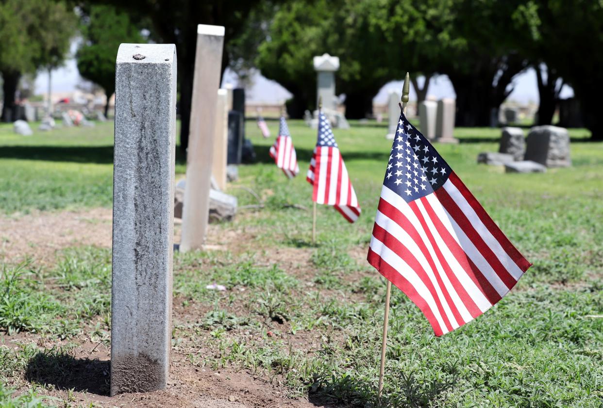 Flags flap in the breeze at Mountain View Cemetery. Legion members plant over 900 at veteran gravesites.