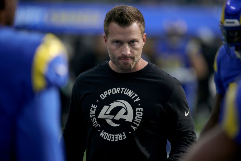 INGLEWOOD, CALIF. - DEC. 25, 2022. Rams head coach Sean McVay watches the team warm up before the game.