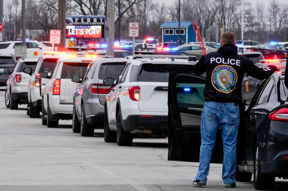 PHOTO: Police respond to Perry High School in Perry, Iowa., Jan. 4, 2024. (Andrew Harnik/AP)