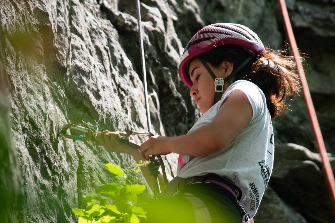 20-year-old Mina Bakhshi is an Afghan woman living in Raleigh with a host family she met through climbing group Ascend: Leadership Through Athletics. She is here pictured climbing a route of the ‘Fear of Flying’ climbing area at Pilot Mountain State Park, north of Winston-Salem on Sunday, May 15, 2022.