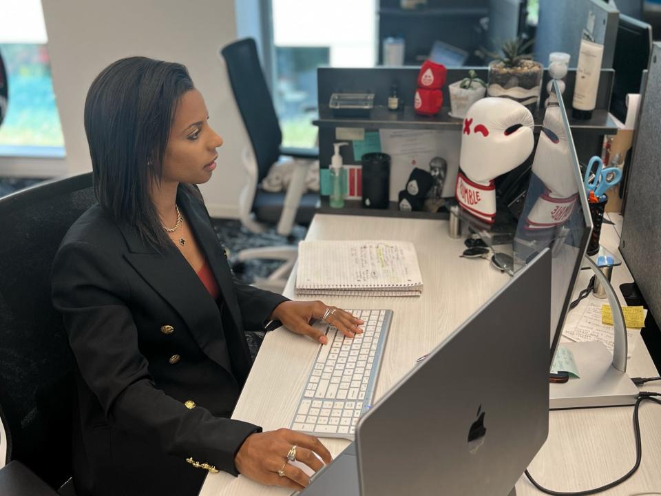 Rachelle Dejean at her desk.