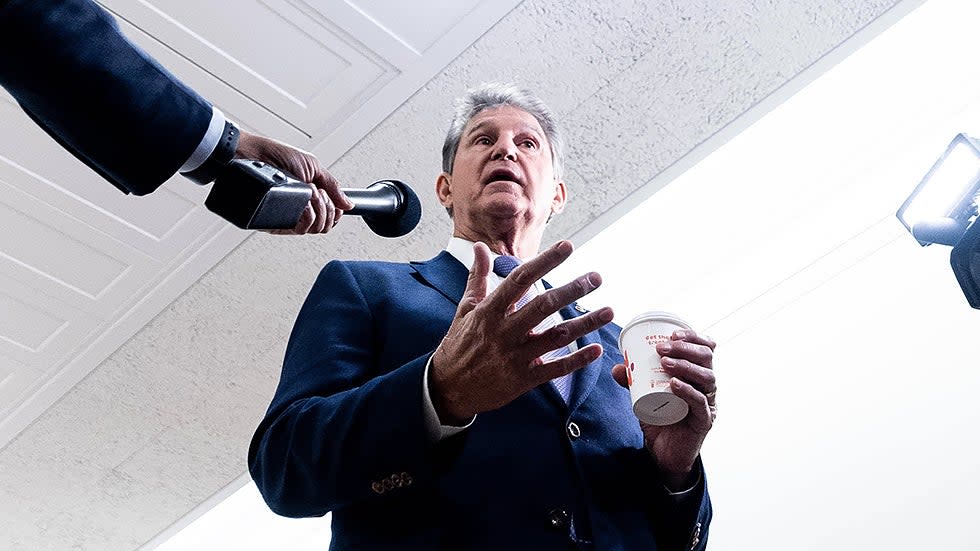 Sen. Joe Manchin (D-W.Va.) speaks to reporters prior to a  Senate Energy and Natural Resources Committee hearing  on Tuesday, Nov. 16, 2021.