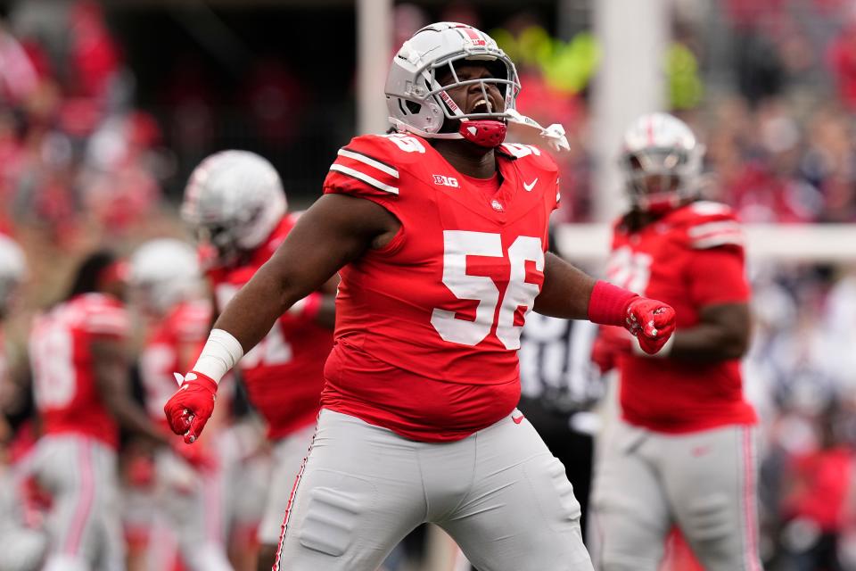 Oct 21, 2023; Columbus, Ohio, USA; Ohio State Buckeyes defensive lineman Kayden McDonald (56) celebrates during the second half of the NCAA football game against the Penn State Nittany Lions at Ohio Stadium. Ohio State won 20-12.