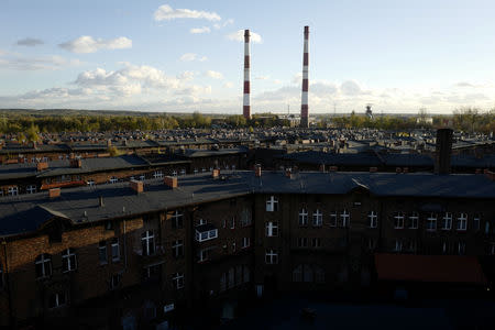 Houses and the Wieczorek mine power plant chimneys are seen in Nikiszowiec district in Katowice, Poland, October 24, 2018. REUTERS/Kacper Pempel