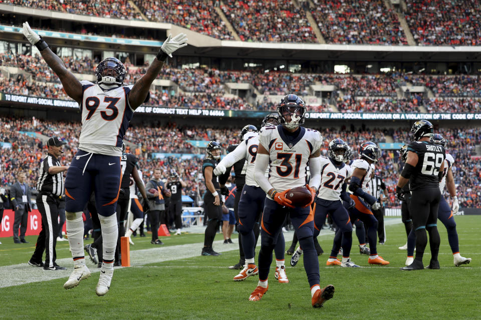 Denver Broncos players react during the NFL football game between Denver Broncos and Jacksonville Jaguars at Wembley Stadium in London, Sunday, Oct. 30, 2022. (AP Photo/Ian Walton)