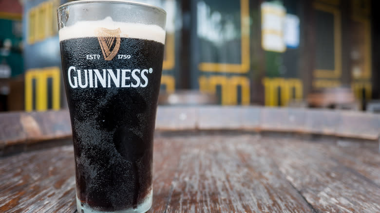 Guinness beer glass on table