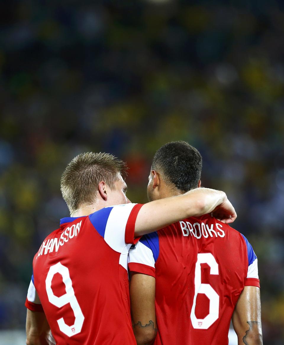 John Brooks of the U.S. (R) and teammate Aron Johannsson celebrate their win against Ghana after their 2014 World Cup Group G soccer match at the Dunas arena in Natal June 16, 2014. REUTERS/Stefano Rellandini (BRAZIL - Tags: SOCCER SPORT WORLD CUP)