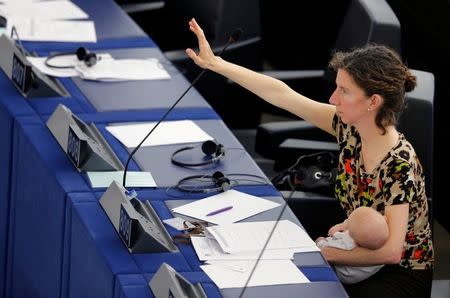 FILE PHOTO: European Parliament Member Anneliese Dodds of the UK, holds her baby as she arrives to take part in a voting session at the European Parliament in Strasbourg, France, April 14, 2016. REUTERS/Vincent Kessler/File Photo