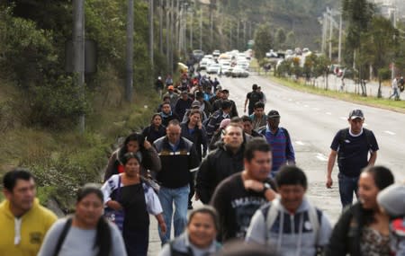 Trucks block main roads during protests after Ecuador's President Lenin Moreno's government ended four-decade-old fuel subsidies, in Carapungo, near Quito