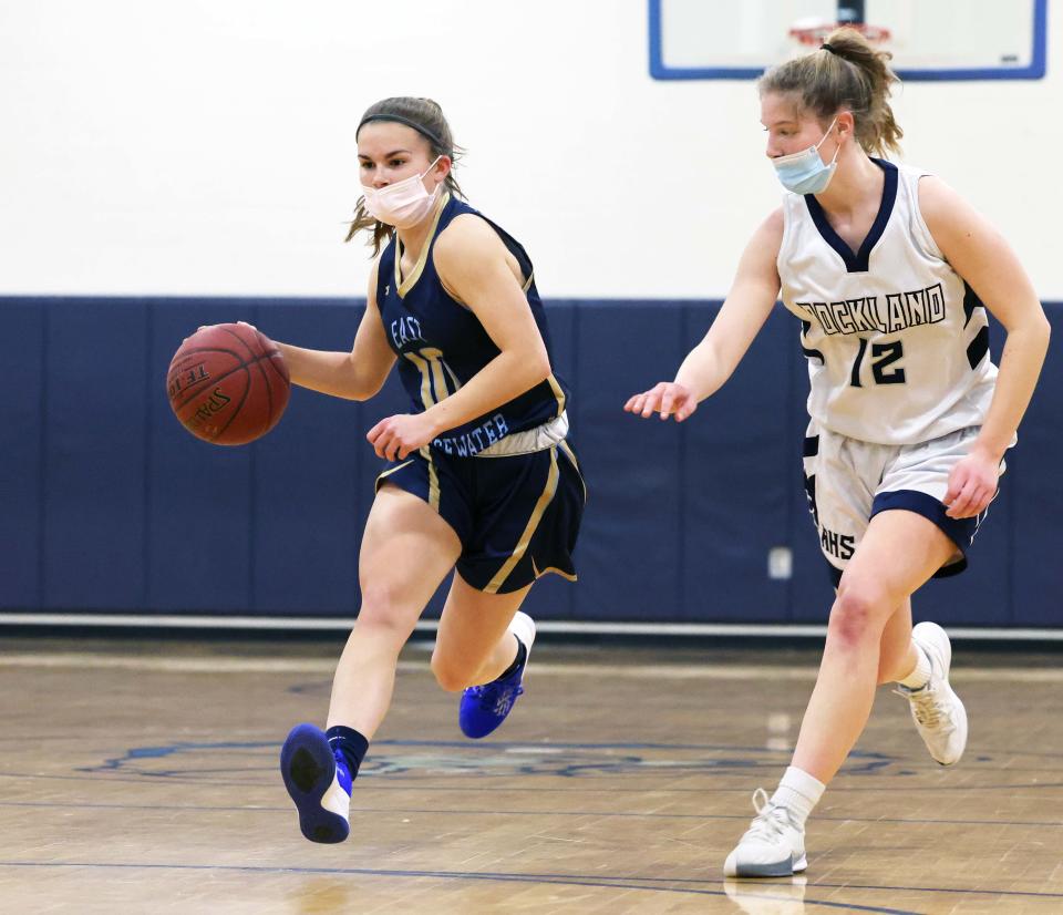 East Bridgewater's Erin Condon dribbles past Rockland's Maggie Elie, during a game on Tuesday, Jan. 18, 2022.  