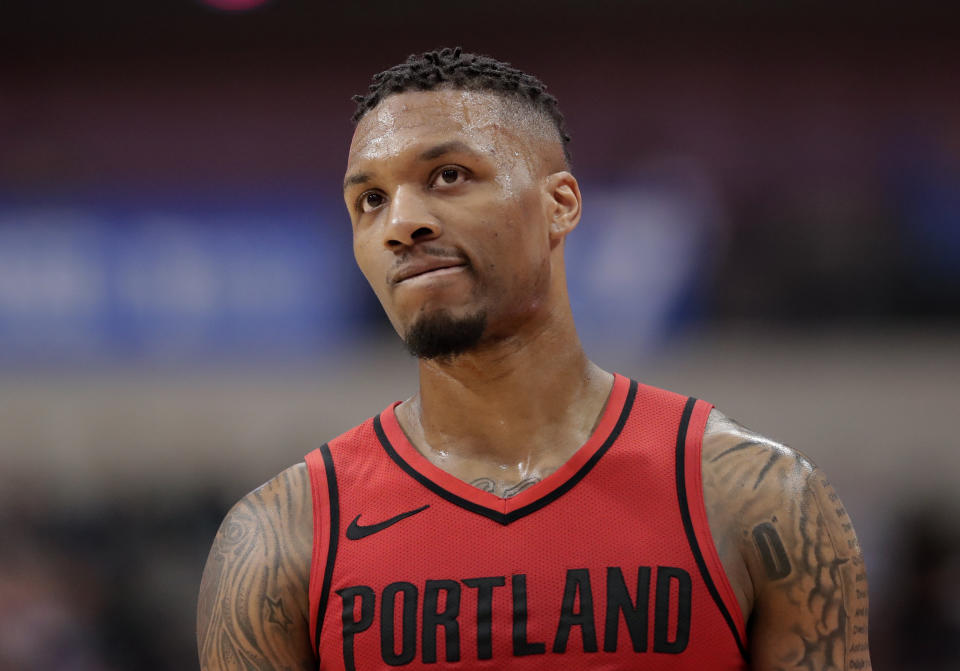 Damian Lillard injured his left ankle Tuesday night. (AP)