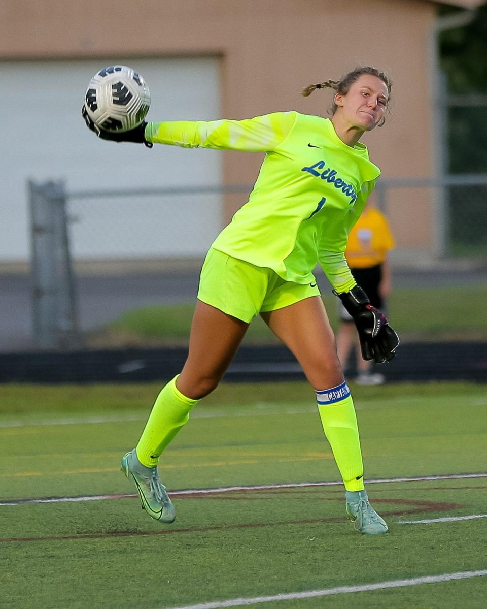 Olentangy Liberty goalie Taylor Thomas clears the ball against host Olentangy on Aug. 12. Thomas had six saves in the 1-all tie.