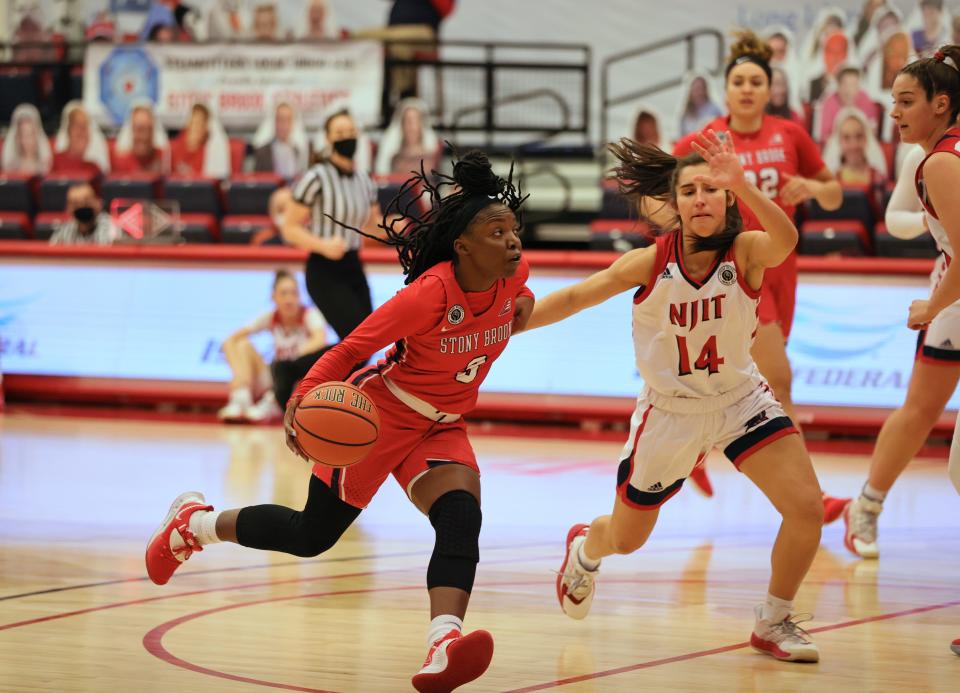 Asiah Dingle makes her way to the basket while playing  playing for Stony Brook.