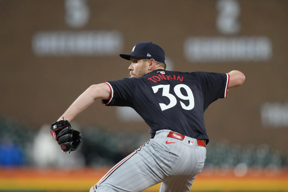 Minnesota Twins pitcher Michael Tonkin throws during the seventh inning of a baseball game against the Detroit Tigers, Friday, April 12, 2024, in Detroit. (AP Photo/Carlos Osorio)