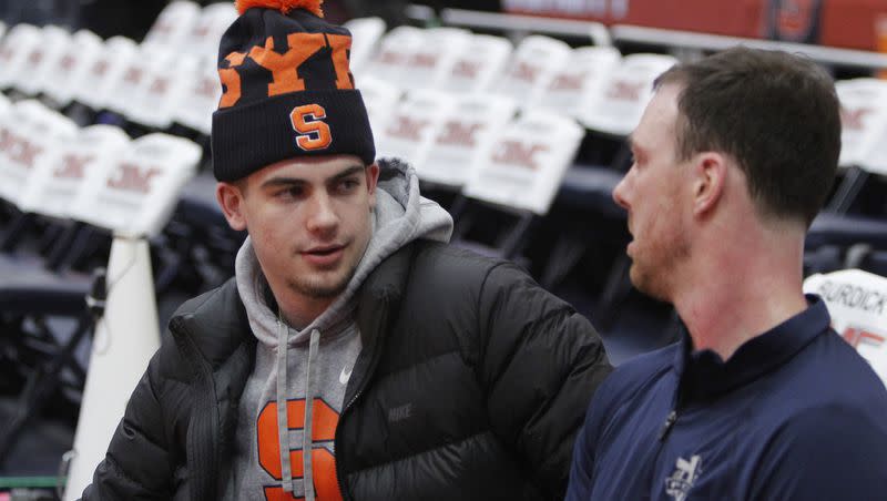 Syracuse guard Joe Girard III, left, talks with Syracuse assistant coach Gerry McNamara, right, before a game against Duke in Syracuse, N.Y., Saturday, Feb. 23, 2019. Girard is among the players BYU is reportedly chasing in the transfer portal.