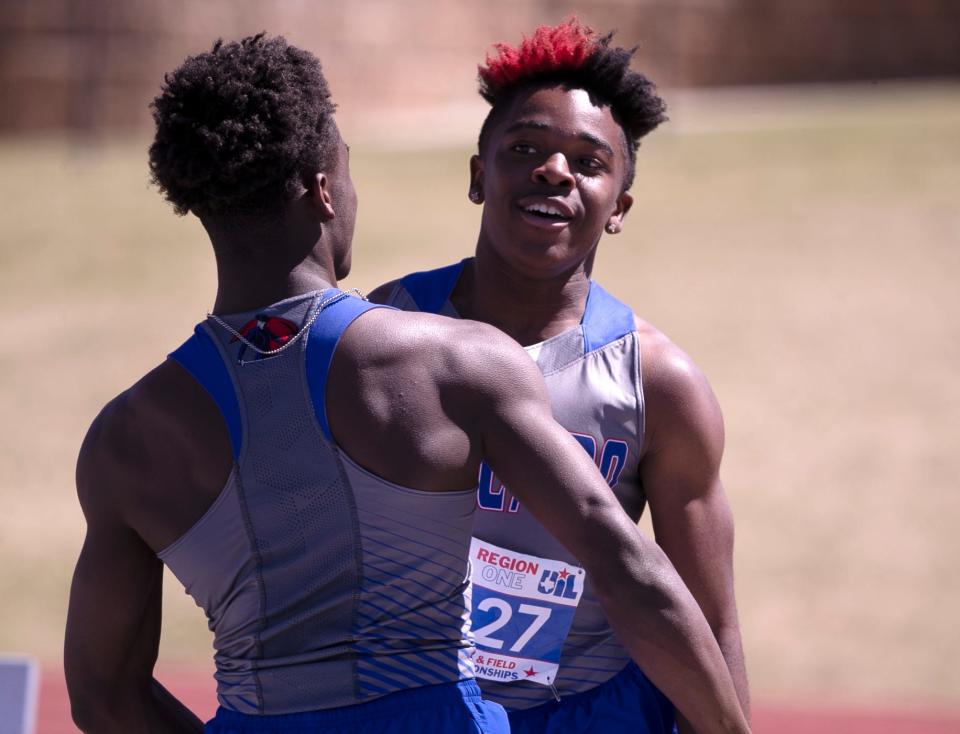 Estacado's James Bozeman, background, and Cedric Ross celebrate winning the 800-meter relay at the Region I-4A track and field meet, Saturday, April 29, 2023, at Lowrey Field.