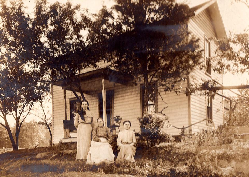 A postcard mailed from Texas 78 years ago was supposed to be delivered to this house on state Route 179 in Holmes County's Lakeville. It was addressed to Clara and Grace Harry. In the photo are Clara's aunts, Sophia and Emma, with her grandmother Rush.